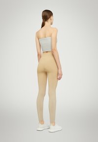Wolford FADING SHINE - Leggings - gold shine