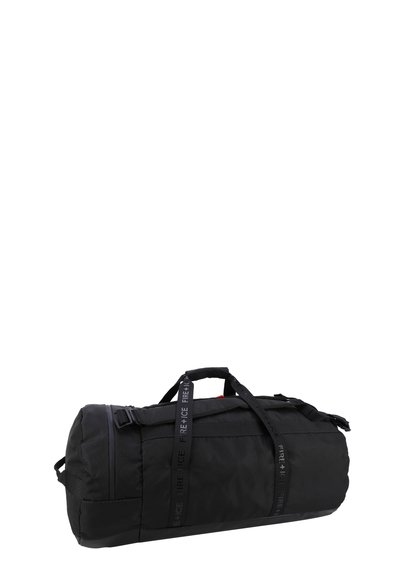 Black duffel bag with textured fabric, featuring a zip closure, top handles, and detachable shoulder strap. Includes logo accents.