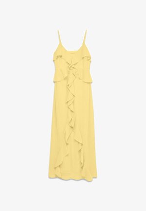 Kollane varrukateta maksikleit, millel on õhukesed rihmad ja esiküljel ning korseti ümber langevad volangid.