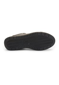 Black rubber shoe sole with a textured surface, featuring horizontal and vertical tread patterns for grip and traction.