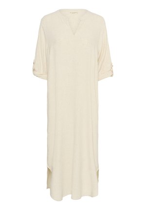 Túnica de color beige claro con escote en V, mangas tres cuartos enrollables y aberturas laterales. Fabricada con un tejido suave y Texturizado. Diseño minimalista.