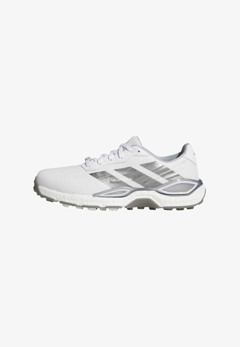 Baskets blanches de sport avec des rayures argentées, fermeture à lacets, semelle amortissante et semelle extérieure texturée pour une bonne adhérence, vues de profil.