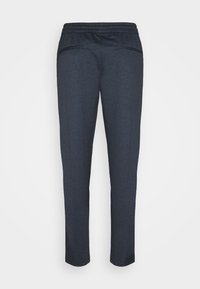 Mörkblå, strukturerade byxor med elastisk midja, slim fit och två små fickor på baksidan. Slät tyg med ett subtilt mönster.