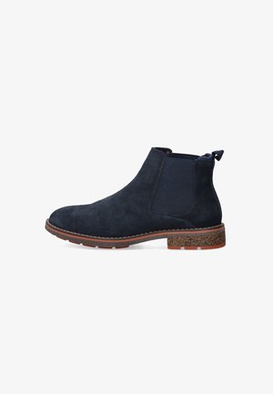 Botas Chelsea de ante azul marino con paneles laterales elásticos, un tacón marrón texturizado y una lengüeta en la parte trasera; silueta estilizada para un uso fácil.