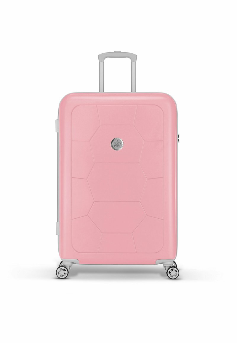 Pink hard-shell suitcase with a textured hexagonal design, silver hardware, extendable handle, and four swivel wheels for mobility.