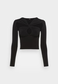Svart långärmad topp i stretchigt material, med en vriden design vid halsringningen och ett utstansat detalj i mitten.
