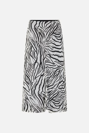 Black and white zebra-patterned skirt with a flowy design, featuring a black waistband and lightweight, textured fabric.