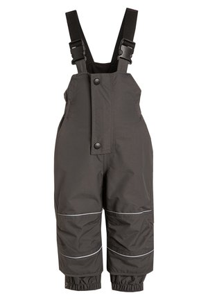 Wodoodporne czarne ogrodniczki z regulowanymi ramiączkami, zapięciem na zatrzaski z przodu i elastycznymi mankietami. Odbijające światło akcenty na nogawkach. Miękka tekstura.