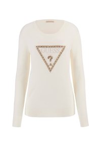 Suéter crema de manga larga, con un escote redondeado y un diseño de logo triangular adornado con strass y texto en el centro.