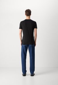 Calvin Klein Jeans OUTLINE MONOLOGO TEE - T-shirts print - black