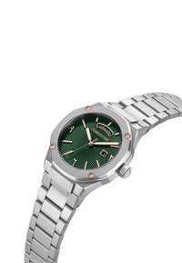 Reloj octogonal con unDial verde texturizado, manecillas y marcadores en oro rosa, pulsera de acero inoxidable plata y una ventana de fecha a las 6 en punto.