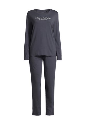 Long-sleeve, navy pajama set made of soft fabric. Features a round neckline and front text print "Marc O'Polo EST. IN STOCKHOLM". Tapered pants.