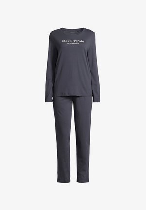 Long-sleeve, navy pajama set made of soft fabric. Features a round neckline and front text print "Marc O'Polo EST. IN STOCKHOLM". Tapered pants.