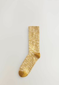 Goldbesprenkelte Socke aus strukturiertem Strickmaterial, mit einer einfarbigen goldenen Zehe und einem gerippten Bündchen für einen engen Sitz.