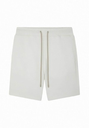 Shorts décontractés blancs avec taille élastique et cordons beiges, dotés de poches latérales et d'un design simple et épuré.
