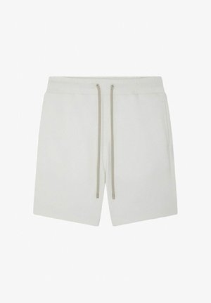 Shorts décontractés blancs avec taille élastique et cordons beiges, dotés de poches latérales et d'un design simple et épuré.