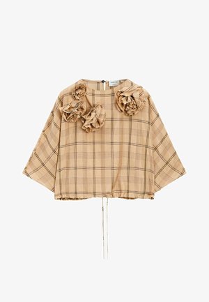Top à carreaux beige avec des accents floraux bouffants, coupe ample, encolure arrondie et ourlet à cordon. Tissu texturé qui favorise un look décontracté.