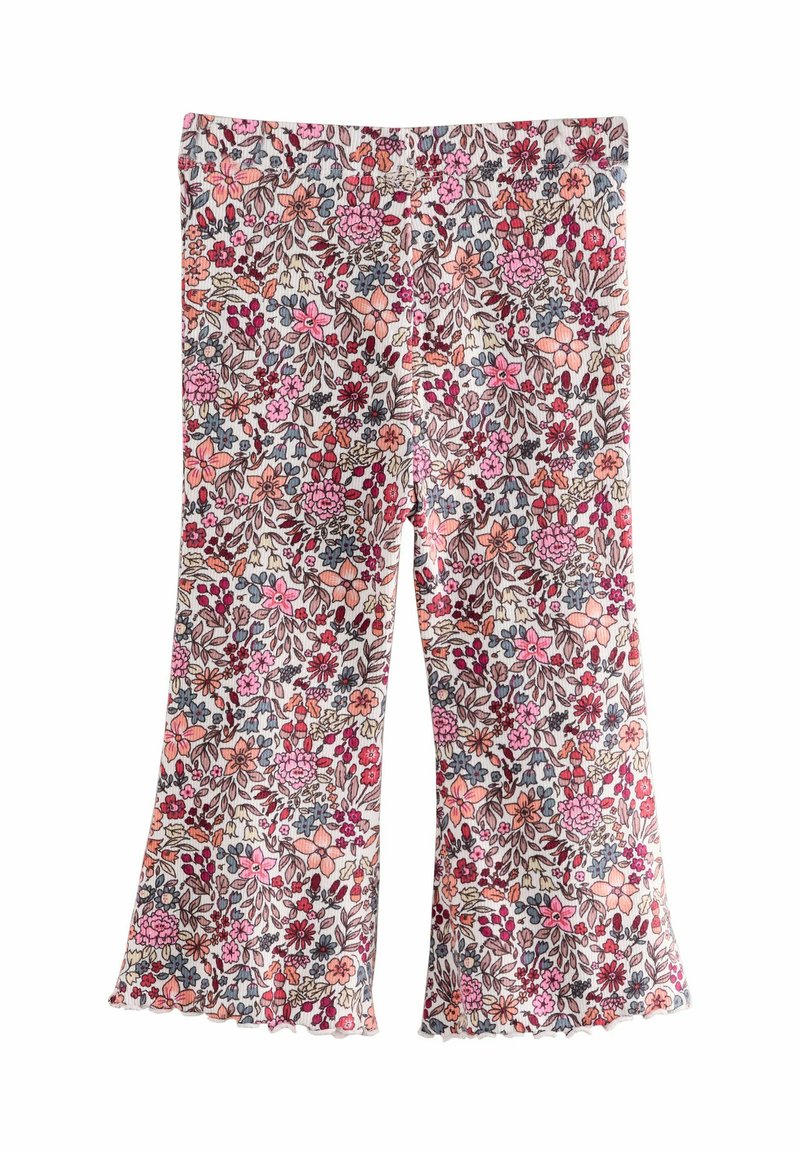 Uitlopende bloemenleggings van lichte stof, met een meerkleurig patroon van roze, rode en blauwe bloemen op een crème achtergrond, met een golvende zoom.
