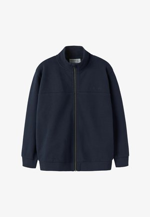 Veste zippée bleu marine en tissu texturé, dotée d'un col montant, de poignets côtelés et d'un logo en relief sur la poitrine.
