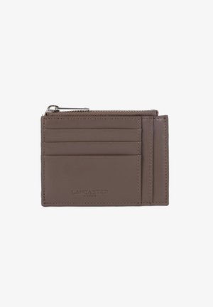 Brown leather cardholder with four card slots, a zippered coin pocket, and "LANCASTER PARIS" embossed on front.