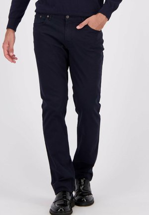 Donker marineblauwe katoenen broek met een slim fit en steekzakken. Voorzien van een knoop- en ritssluiting en een gladde textuur.