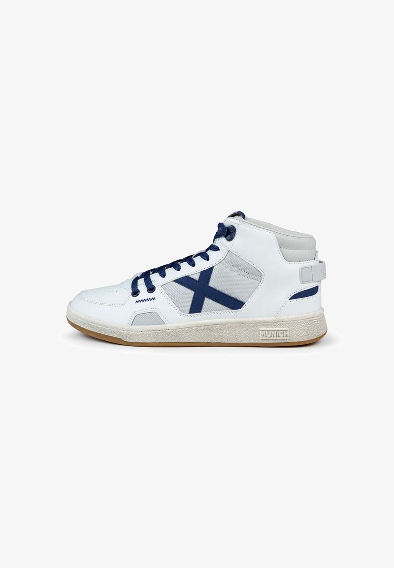 High-top sneaker, primarily white with navy accents. Features a textured sole, padded collar, and mesh panels. Logo on the heel.