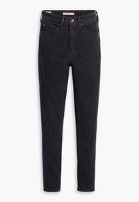 Jeans ajustados negros de mezclilla, con cintura alta, diseño de cinco bolsillos y acentos de hardware en bronce. Textura suave.