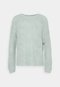 Pull en tricot vert menthe clair avec une coupe ample, présentant des motifs en vagues et des poignets côtelés. Texture douce et col rond.