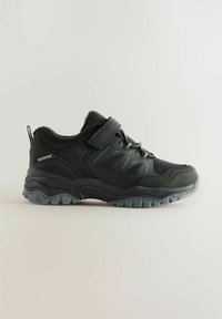 Black waterproof hiking shoe with textured upper and reinforced toe. Features elastic laces and a hook-and-loop strap for secure fit.
