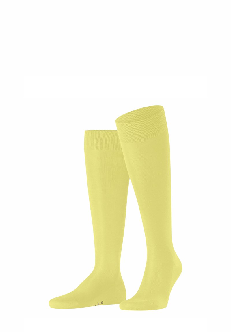 Calzini al ginocchio di un vivace giallo, realizzati in un tessuto morbido e elastico. Design senza cuciture con bordo superiore a costine per comfort e vestibilità.