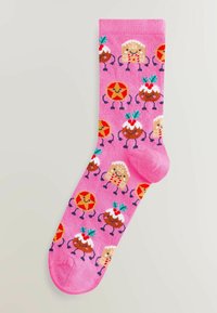 Knit pink socks featuring a playful pattern of gingerbread men, desserts, and colorful accents. Soft texture with a reinforced toe.