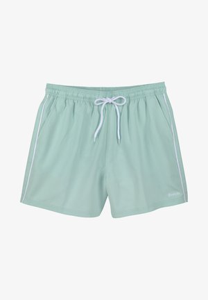 Heledad rohelised ujumispüksid elastse vöökohtaga, valge paelaga ja kontrastsete valgete külgtriipudega. Varruka ääres on väike logo.