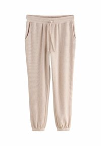 Beiga ribbade joggers med dragsko i midjan, sidofickor och elastiska muddar vid vristerna, med en mjuk textur.