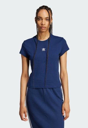 Navy short-sleeve t-shirt made of cotton, featuring a white adidas logo on the chest and a fitted design, paired with a matching ribbed skirt.