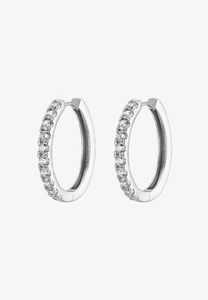 Silver hoop earrings featuring a row of small clear cubic zirconia stones. Smooth, polished surface with a minimalist design.