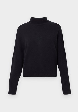 Sort turtleneck sweater med lange ærmer, lavet af et blødt strikkemateriale, med cropped længde og ribbede halsåbning og manchetter.