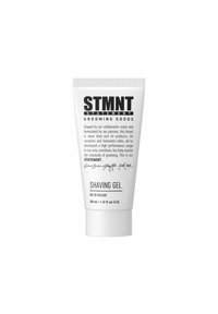 STMTN Shaving Gel in a 30 ml white tube. Features black text for branding and product details. Smooth, matte texture. Compact design.