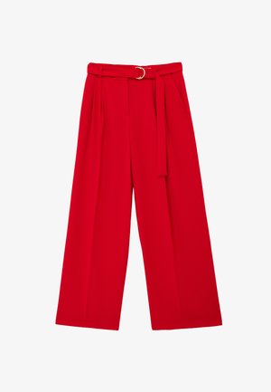 Punaiset leveälahkeiset housut, joissa on korkea vyötärö, laskokset edessä, sivutaskut ja samaa kangasta oleva vyö, jossa kultainen metallisolki.