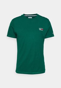 Zelené bavlněné tričko s kulatým výstřihem, krátkými rukávy a malým bílým logem "TOMMY JEANS" na horní levé straně.
