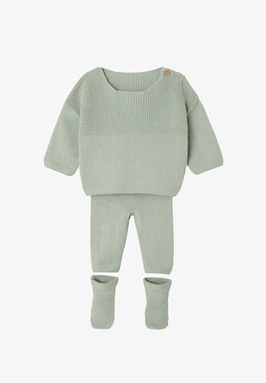 Soft green knitted baby outfit with long-sleeve sweater featuring a button on shoulder, matching pants, and folded booties.