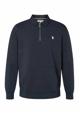 Sötétkék polár pulóver cipzáras állógallérral, elülső zsebbel és hímzett logóval a bal mellrészen. Puha tapintás és rugalmas mandzsetta.