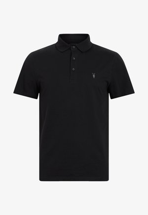 Polo noir en coton avec un col classique, une patte de boutonnage à trois boutons et un petit logo brodé de crâne de chèvre.