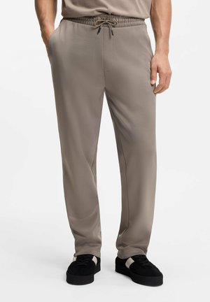 DOLOS - Tracksuit bottoms - light brown seven