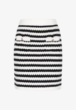 Mini falda de punto con rayas horizontales en blanco y negro, dos bolsillos frontales con botones a presión y una silueta ajustada.
