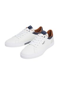 White sneakers with a smooth leather upper, navy and brown accents, lace-up front, and textured rubber sole for grip.