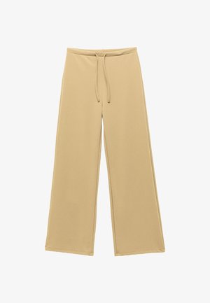 Pantalones de pierna ancha beige con cinturilla elástica y cordón, fabricados en una tela suave, exhibidos de forma plana sobre un fondo blanco.