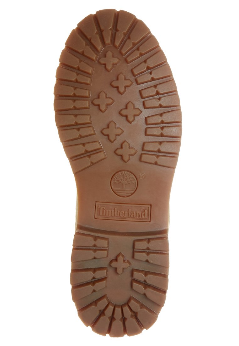 Semelle en caoutchouc brun avec un motif de crampons robuste, arborant un logo d'arbre central et "Timberland" embossé en bas.