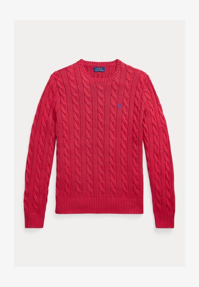 Raudonas megztinis su ažūrine tekstūra, su apvalia iškirpte, rausvais rankogaliais ir apačia, ir mažas siuvinėtas logotipas ant krūtinės. Medžiaga: medvilnės ir akrilo mišinys.