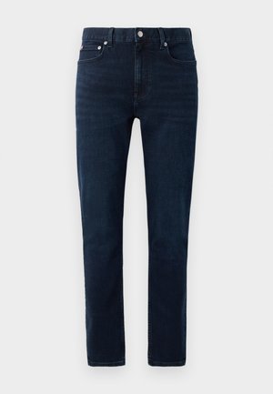 Dark wash denim jeans with a straight fit. Features a classic button closure, five pockets, and subtle stitching details.
