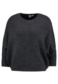 Mörkgrå oversized tröja med rund halslinning, ribbade ärmslut och mjuk textur. Tillverkad av stickat material med en avslappnad passform.